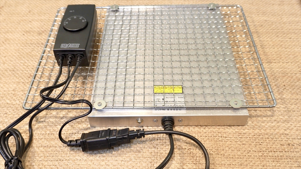 暖突をバーベキュー用のアミに取り付け